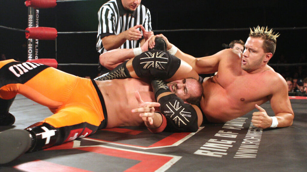 Nigel McGuinness wrapping his legs around Claudio Castagnoli in Ring of Honor