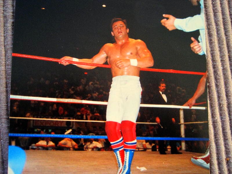 Dynamite Kid leans against the ropes during a WWF match in the 1980s
