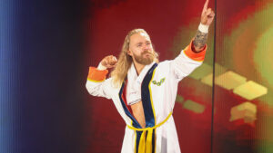 Tyler Bate poses on the ramp wearing a robe.