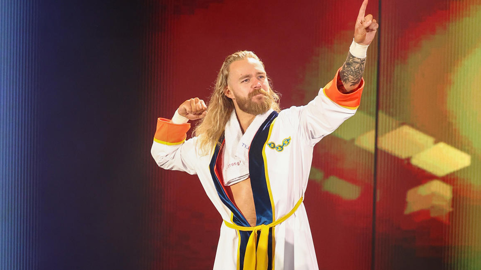 Tyler Bate poses on the ramp wearing a robe.